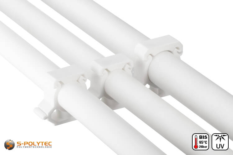 Aqua-Plus PP-R pipe clips in white for surface mounting of PP-R pipes in various sizes.