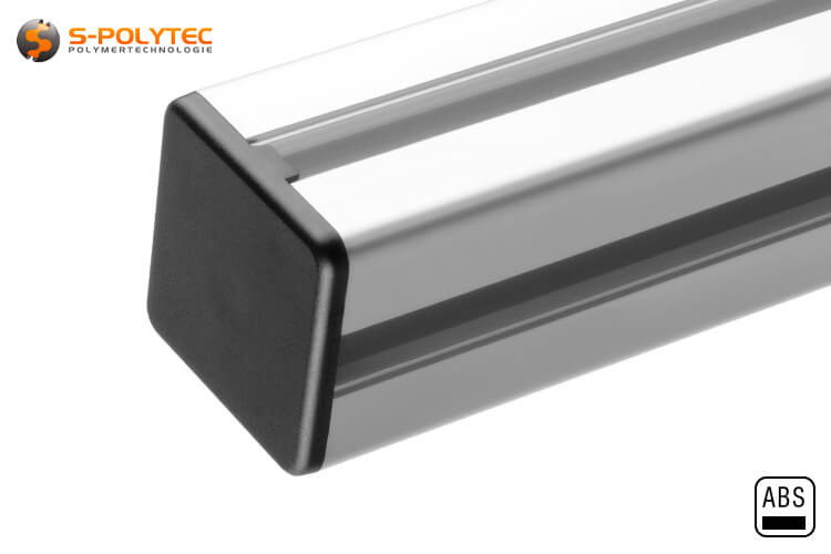 The end cap is inserted into the through-hole of the construction profile and is flush with the profile