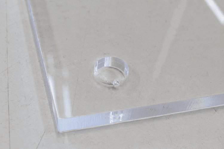 Chipped hole edge caused by inadequate support or excessive pressure