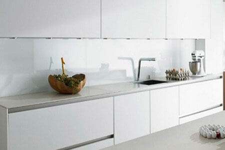 DecoVitas SnoWhite decorative panels as kitchen backsplash cut to size by S-Polytec
