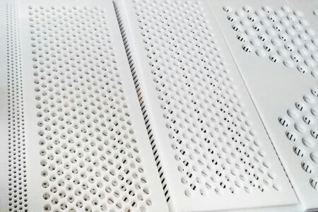 Examples of different milling operations for perforated sheets made of white plastic