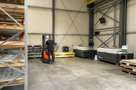 Thomas storing plastic sheets in the high rack