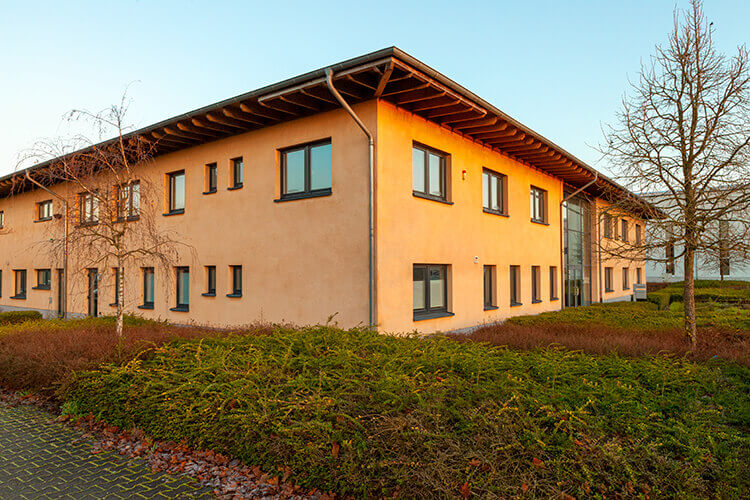 Our office building in the golden sunrise with morning frost